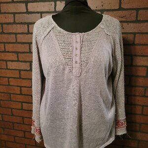 Umgee mixed material bell sleeve top with embroidered flowers.